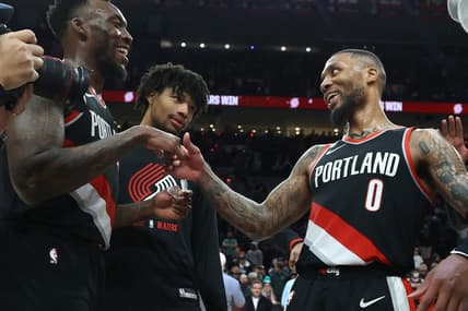 Jan 25, 2023; Portland, Oregon, USA;  Portland Trail Blazers guard Damian Lillard (0) is congratulated by teammate forward Nassir Little (10) after scoring 60 points at Moda Center. Mandatory Credit: Jaime Valdez-USA TODAY Sports