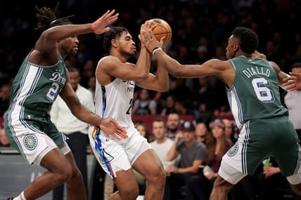 Jan 26, 2023; Brooklyn, New York, USA; Brooklyn Nets guard Cam Thomas (24) looks to pass the ball against Detroit Pistons center Isaiah Stewart (28) and guard Hamidou Diallo (6) during the first quarter at Barclays Center. Mandatory Credit: Brad Penner-USA TODAY Sports