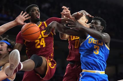Jan 26, 2023; Los Angeles, California, USA; Southern California Trojans forward Joshua Morgan (24) and forward Kobe Johnson (0) battles for the ball with UCLA Bruins guard Jaime Jaquez Jr. (24) and forward Adem Bona (3) in the firsthalf at Galen Center. Mandatory Credit: Kirby Lee-USA TODAY Sports