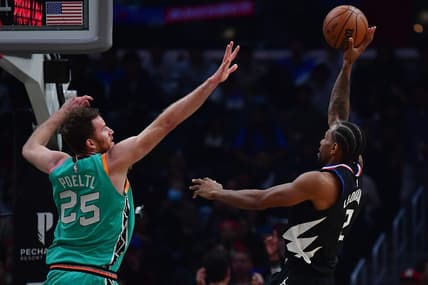 Jan 26, 2023; Los Angeles, California, USA; Los Angeles Clippers forward Kawhi Leonard (2) shoots against San Antonio Spurs center Jakob Poeltl (25) during the first half at Crypto.com Arena. Mandatory Credit: Gary A. Vasquez-USA TODAY Sports