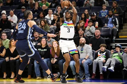 Jan 27, 2023; Minneapolis, Minnesota, USA; Minnesota Timberwolves forward Jaden McDaniels (3) shoots while Memphis Grizzlies forward Dillon Brooks (24) defends during the first quarter at Target Center. Mandatory Credit: Matt Krohn-USA TODAY Sports