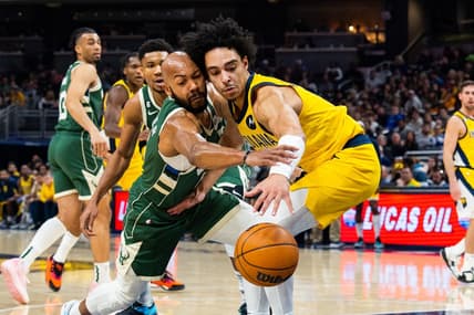 Jan 27, 2023; Indianapolis, Indiana, USA; Milwaukee Bucks guard Jevon Carter (5) steals the ball from Indiana Pacers guard Andrew Nembhard (2)  in the second quarter at Gainbridge Fieldhouse. Mandatory Credit: Trevor Ruszkowski-USA TODAY Sports
