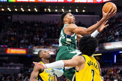 Jan 27, 2023; Indianapolis, Indiana, USA; Milwaukee Bucks forward Giannis Antetokounmpo (34) shoots the ball while Indiana Pacers guard Andrew Nembhard (2) defends in the second half at Gainbridge Fieldhouse. Mandatory Credit: Trevor Ruszkowski-USA TODAY Sports