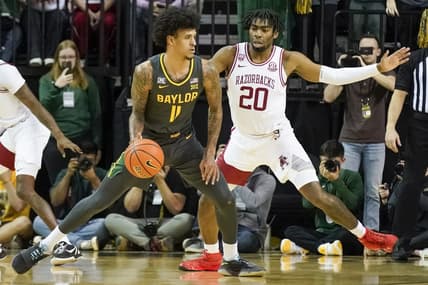 Jan 28, 2023; Waco, Texas, USA;  Baylor Bears forward Jalen Bridges (11) controls the ball against Arkansas Razorbacks forward Kamani Johnson (20) during the first half at Ferrell Center. Mandatory Credit: Raymond Carlin III-USA TODAY Sports