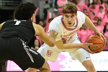 Jan 28, 2023; Omaha, Nebraska, USA;  Creighton Bluejays guard Baylor Scheierman (55) looks to drive against Xavier Musketeers guard Desmond Claude (1) in the second half at CHI Health Center Omaha. Mandatory Credit: Steven Branscombe-USA TODAY Sports