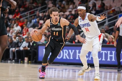 Jan 28, 2023; Atlanta, Georgia, USA; Atlanta Hawks guard Trae Young (11) drives on LA Clippers guard Terance Mann (14) in the first quarter at State Farm Arena. Mandatory Credit: Brett Davis-USA TODAY Sports
