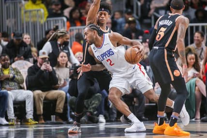 Jan 28, 2023; Atlanta, Georgia, USA; LA Clippers forward Kawhi Leonard (2) is defended by Atlanta Hawks forward De'Andre Hunter (12) in the first quarter at State Farm Arena. Mandatory Credit: Brett Davis-USA TODAY Sports