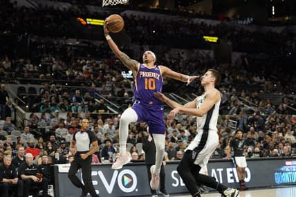 Jan 28, 2023; San Antonio, Texas, USA; Phoenix Suns guard Damion Lee (10) lays in a basket while defended by San Antonio Spurs forward Zach Collins (23) during the first half at AT&T Center. Mandatory Credit: Scott Wachter-USA TODAY Sports