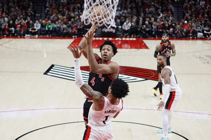 Jan 28, 2023; Portland, Oregon, USA; Toronto Raptors small forward Scottie Barnes (4) shoots the ball against Portland Trail Blazers shooting guard Anfernee Simons (1) during the first half at Moda Center. Mandatory Credit: Soobum Im-USA TODAY Sports