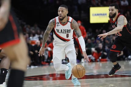 Jan 28, 2023; Portland, Oregon, USA; Portland Trail Blazers point guard Damian Lillard (0) dribbles the ball past Toronto Raptors shooting guard Fred VanVleet (23) during the first half at Moda Center. Mandatory Credit: Soobum Im-USA TODAY Sports