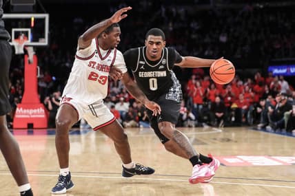 Jan 29, 2023; New York, New York, USA;  Georgetown Hoyas guard Brandon Murray (0) looks to drive past St. John's Red Storm forward David Jones (23) in the first half at Madison Square Garden. Mandatory Credit: Wendell Cruz-USA TODAY Sports
