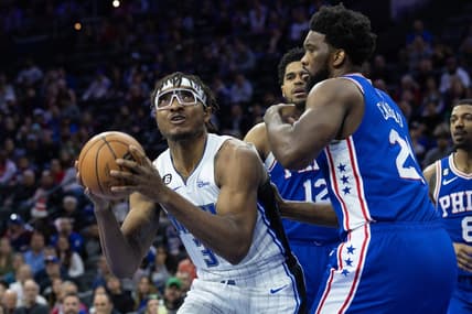 Jan 30, 2023; Philadelphia, Pennsylvania, USA; Orlando Magic center Wendell Carter Jr. (34) controls the ball in front of Philadelphia 76ers center Joel Embiid (21) during the first quarter at Wells Fargo Center. Mandatory Credit: Bill Streicher-USA TODAY Sports