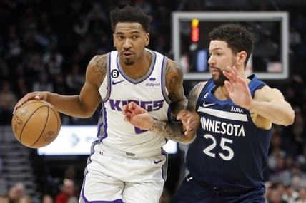 Jan 30, 2023; Minneapolis, Minnesota, USA; Sacramento Kings guard Malik Monk (0) works around Minnesota Timberwolves guard Austin Rivers (25) in the second quarter at Target Center. Mandatory Credit: Bruce Kluckhohn-USA TODAY Sports