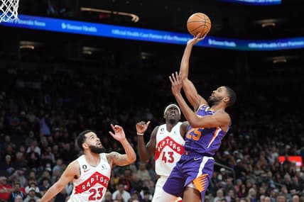 Jan 30, 2023; Phoenix, Arizona, USA; Phoenix Suns forward Mikal Bridges (25) shoots over Toronto Raptors guard Fred VanVleet (23) and Toronto Raptors forward Pascal Siakam (43) during the first half at Footprint Center. Mandatory Credit: Joe Camporeale-USA TODAY Sports