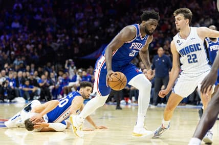 Jan 30, 2023; Philadelphia, Pennsylvania, USA; Philadelphia 76ers center Joel Embiid (21) dribbles the ball after a pass from Georges Niang (20) against Orlando Magic center Moritz Wagner (21) in front of forward Franz Wagner (22) during the fourth quarter at Wells Fargo Center. Mandatory Credit: Bill Streicher-USA TODAY Sports