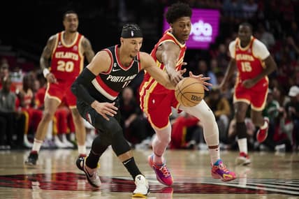 Jan 30, 2023; Portland, Oregon, USA; Portland Trail Blazers guard Josh Hart (11) controls the basketball during the first half against Atlanta Hawks forward De'Andre Hunter (12) at Moda Center. Mandatory Credit: Troy Wayrynen-USA TODAY Sports