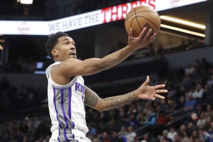 Jan 30, 2023; Minneapolis, Minnesota, USA; Sacramento Kings guard Malik Monk (0) goes to the basket against the Minnesota Gophers the Minnesota Timberwolves in the first quarter at Target Center. Mandatory Credit: Bruce Kluckhohn-USA TODAY Sports