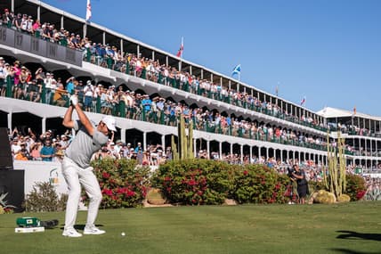 Scottie Scheffler plays hit tee shot on the par 3 16th hole during the final round of the WM Phoenix Open golf tournament. Mandatory Credit: Allan Henry-USA TODAY Sports