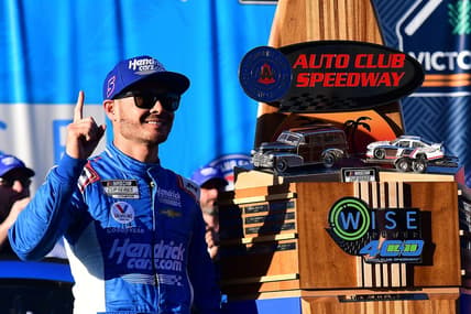 Feb 27, 2022; Fontana, California, USA; NASCAR Cup Series driver Kyle Larson (5) celebrates his victory of the WISE Power 400 at Auto Club Speedway. Mandatory Credit: Gary A. Vasquez-USA TODAY Sports