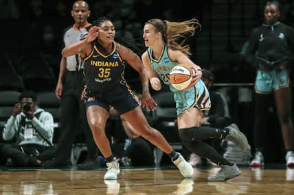 Jun 1, 2022; Brooklyn, New York, USA; New York Liberty guard Sabrina Ionescu (20) drives past Indiana Fever guard Victoria Vivians (35) in the first quarter at Barclays Center. Mandatory Credit: Wendell Cruz-USA TODAY Sports
