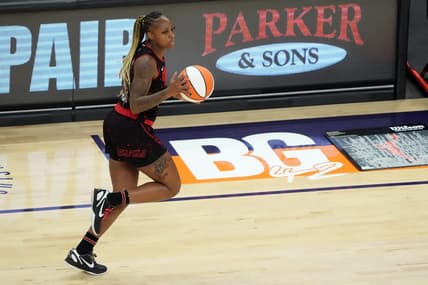 Jun 29, 2022; Phoenix, Arizona, USA; Indiana Fever guard Tiffany Mitchell (25) dribbles by a painted section of the court reading BG 42 in support of Phoenix Mercury center Brittney Griner (not pictured) during the first half at Footprint Center. Mandatory Credit: Joe Camporeale-USA TODAY Sports