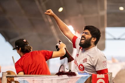 Aug 13, 2022; Toronto, Ontario, CAN; Toronto FC fans celebrate a goal against Portland Timbers during the first half at BMO Field. Mandatory Credit: Kevin Sousa-USA TODAY Sports