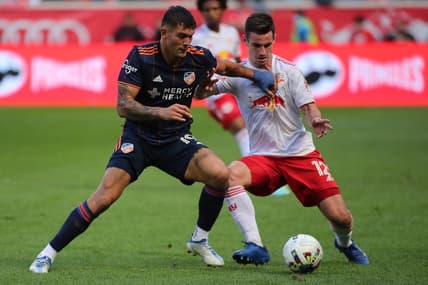 Oct 15, 2022; Harrison, New Jersey, USA;  FC Cincinnati forward Brandon Vazquez (19) controls the ball against New York Red Bulls defender Dylan Nealis (12) during the second half at Red Bull Arena. Mandatory Credit: Wendell Cruz-USA TODAY Sports