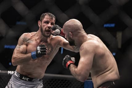 Oct 22, 2022; Abu Dhabi, UAE; Volkan Oezdemir (red gloves) and Nikita Krylov (blue gloves) during UFC 280 at Etihad Arena. Mandatory Credit: Craig Kidwell-USA TODAY Sports
