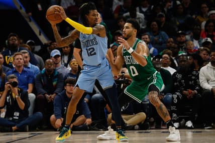 Nov 7, 2022; Memphis, Tennessee, USA; Memphis Grizzlies guard Ja Morant (12) and Boston Celtics forward Jayson Tatum (0) during the second half at FedExForum. Mandatory Credit: Petre Thomas-USA TODAY Sports