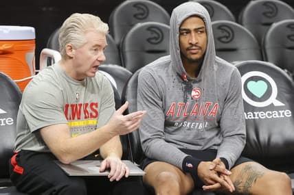 Nov 10, 2022; Atlanta, Georgia, USA; Atlanta Hawks lead assistant coach Joe Prunty talks to forward John Collins (20) before a game against the Philadelphia 76ers at State Farm Arena. Mandatory Credit: Brett Davis-USA TODAY Sports