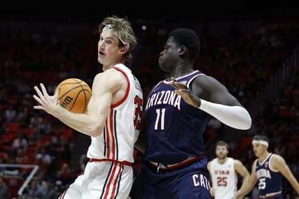 Dec 1, 2022; Salt Lake City, Utah, USA; Utah Utes center Branden Carlson (35) looks to drive against Arizona Wildcats center Oumar Ballo (11) in the second half at Jon M. Huntsman Center. Mandatory Credit: Jeffrey Swinger-USA TODAY SportsDec 1, 2022; Salt Lake City, Utah, USA;  at Jon M. Huntsman Center. Mandatory Credit: Jeffrey Swinger-USA TODAY Sports