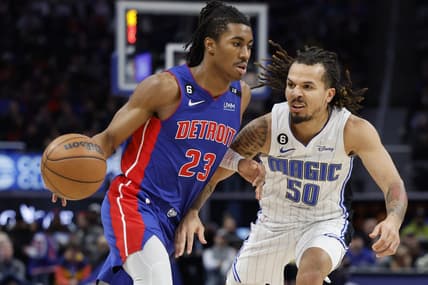 Dec 28, 2022; Detroit, Michigan, USA;  Detroit Pistons guard Jaden Ivey (23) dribbles on Orlando Magic guard Cole Anthony (50) in the second half at Little Caesars Arena. Mandatory Credit: Rick Osentoski-USA TODAY Sports