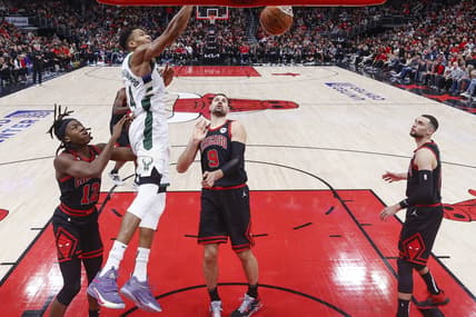Dec 28, 2022; Chicago, Illinois, USA; Giannis Antetokounmpo (34) scores against the Chicago Bulls during the second half at United Center. Mandatory Credit: Kamil Krzaczynski-USA TODAY Sports