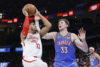 Dec 31, 2022; Oklahoma City, Oklahoma, USA; Philadelphia 76ers forward Tobias Harris (12) shoots the ball against Oklahoma City Thunder center Mike Muscala (33) during the second quarter at Paycom Center. Mandatory Credit: Alonzo Adams-USA TODAY Sports