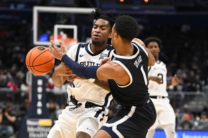 Jan 1, 2023; Washington, District of Columbia, USA; Butler Bulldogs guard Jayden Taylor (13) is fouled by Georgetown Hoyas guard Primo Spears (1) during the second half at Capital One Arena. Mandatory Credit: Brad Mills-USA TODAY Sports