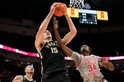 Jan 5, 2023; Columbus, OH, USA;  Purdue Boilermakers center Zach Edey (15) grabs a rebound over Ohio State Buckeyes center Felix Okpara (34) during the NCAA men's basketball game at Value City Arena. Purdue won 71-69. Mandatory Credit: Adam Cairns-The Columbus Dispatch

Basketball Purdue At Ohio State
