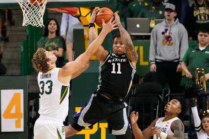 Jan 7, 2023; Waco, Texas, USA; Kansas State Wildcats forward Keyontae Johnson (11) grabs a rebound against Baylor Bears forward Caleb Lohner (33) during the first half at Ferrell Center. Mandatory Credit: Chris Jones-USA TODAY Sports