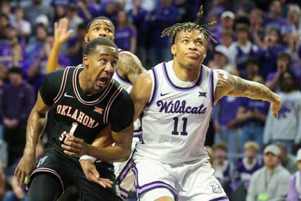 Jan 10, 2023; Manhattan, Kansas, USA; Oklahoma State Cowboys guard Bryce Thompson (1) and Kansas State Wildcats guard Keyontae Johnson (11) battle for a rebound during the second half at Bramlage Coliseum. Mandatory Credit: Scott Sewell-USA TODAY Sports