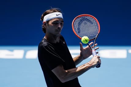 Jan 13, 2023; Melbourne, Victoria, Australia; Taylor Fritz of the United States hits a shot during a practice session on Margaret Court Arena at Melbourne Park. Mandatory Credit: Mike Frey-USA TODAY Sports