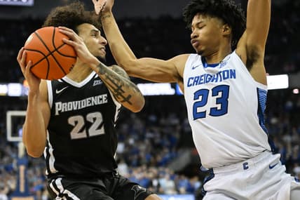 Jan 14, 2023; Omaha, Nebraska, USA;  Creighton Bluejays guard Trey Alexander (23) defends against Providence Friars guard Devin Carter (22) in the second half at CHI Health Center Omaha. Mandatory Credit: Steven Branscombe-USA TODAY Sports