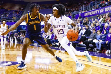 Jan 14, 2023; Seattle, Washington, USA; Washington Huskies guard Keyon Menifield (23) dribbles against California Golden Bears guard Joel Brown (1) during the second half at Alaska Airlines Arena at Hec Edmundson Pavilion. Mandatory Credit: Joe Nicholson-USA TODAY Sports