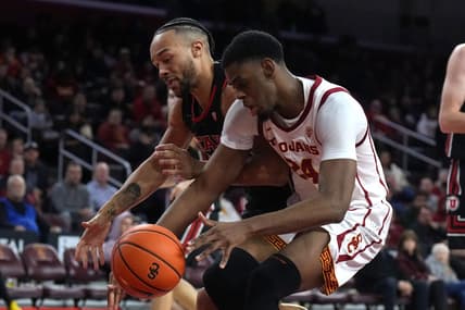 January 14, 2023; Los Angeles, California, USA; Utah Utes guard Marco Anthony (10) and Southern California Trojans forward Joshua Morgan (24) reach for the ball in the second half at Galen Center. Mandatory Credit: Kirby Lee-USA TODAY Sports