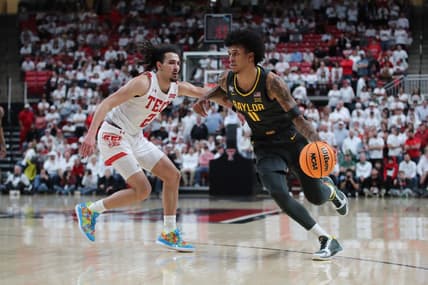 Jan 17, 2023; Lubbock, Texas, USA;  Baylor Bears forward Jalen Bridges (11) works the ball against Texas Tech Red Raiders guard Pop Isaacs (2) in the second half at United Supermarkets Arena. Mandatory Credit: Michael C. Johnson-USA TODAY Sports