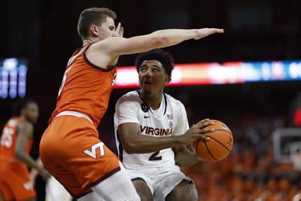 Jan 18, 2023; Charlottesville, Virginia, USA; Virginia Cavaliers guard Reece Beekman (2) drives to the basket as Virginia Tech Hokies guard Sean Pedulla (3) defends in the second half at John Paul Jones Arena. Mandatory Credit: Geoff Burke-USA TODAY Sports
