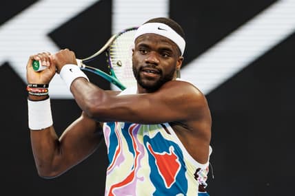 Jan 20, 2023; Melbourne, Victoria, Australia;  Frances Tiafoe of the United States hits a shot against Karen Kachanov of Russia on day five of the 2023 Australian Open tennis tournament at Melbourne Park. Mandatory Credit: Mike Frey-USA TODAY Sports