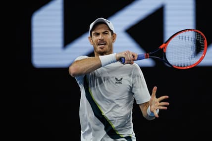 Jan 21, 2023; Melbourne, Victoria, Australia;   Andy Murray of Great Britain hits a forehand against Roberto Bautista-Agut of Spain on day six of the 2023 Australian Open tennis tournament at Melbourne Park. Mandatory Credit: Mike Frey-USA TODAY Sports
