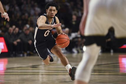 Jan 21, 2023; Winston-Salem, North Carolina, USA;  Virginia Cavaliers guard Kihei Clark (0) drives into an opening in the Wake Forest Demon Deacons defense during the second half at Lawrence Joel Veterans Memorial Coliseum. Mandatory Credit: William Howard-USA TODAY Sports