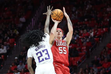 Jan 21, 2023; Salt Lake City, Utah, USA; Utah Utes guard Gabe Madsen (55) shoots against Washington Huskies guard Keyon Menifield (23) in the second half at Jon M. Huntsman Center. Mandatory Credit: Rob Gray-USA TODAY Sports