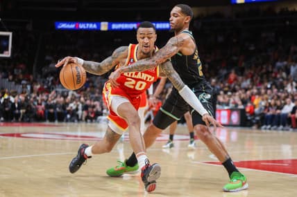 Jan 21, 2023; Atlanta, Georgia, USA; Atlanta Hawks forward John Collins (20) is defended by Charlotte Hornets forward P.J. Washington (25) in the second half at State Farm Arena. Mandatory Credit: Brett Davis-USA TODAY Sports