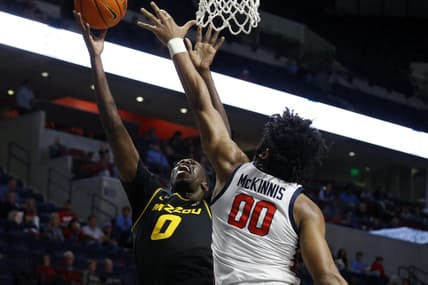 Jan 24, 2023; Oxford, Mississippi, USA; Missouri Tigers forward Mohamed Diarra (0) shoots as Mississippi Rebels forward Jayveous McKinnis (0) defends during the first half at The Sandy and John Black Pavilion at Ole Miss. Mandatory Credit: Petre Thomas-USA TODAY Sports